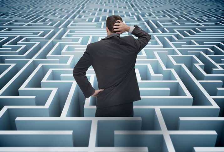 Concept of project management challenges. Confused businessman in a maze