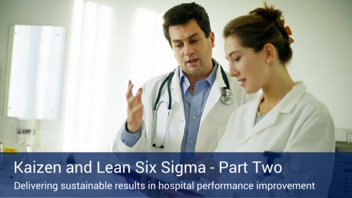 Two healthcare professionals discussing lean six sigma's role in the healthcare industry.