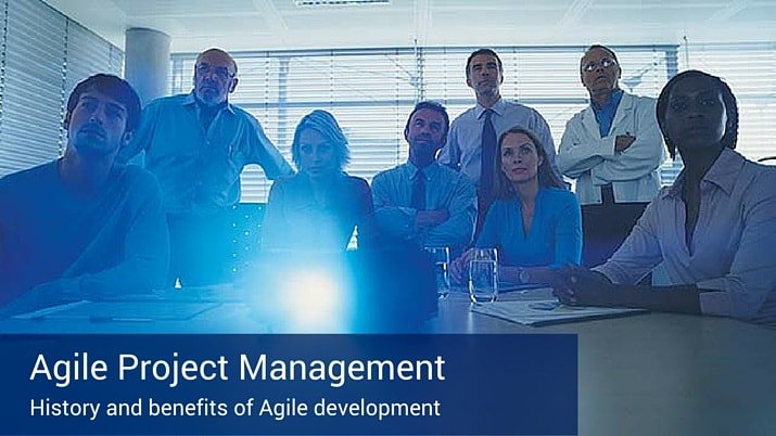A poster that says "agile project management" with a group of coworkers watching a projection screen.