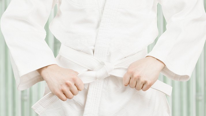A white karate uniform and a white karate belt.