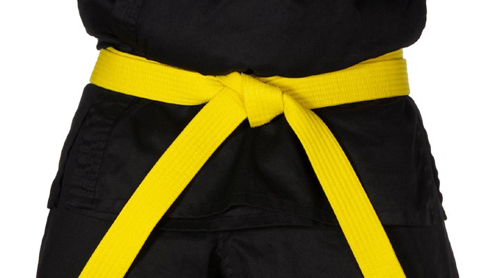 A black karate uniform with a yellow belt.