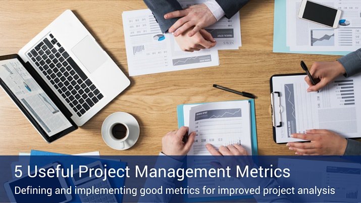"5 useful project management metrics" in white text over transparent blue banner over image of overhead view of an office table with a laptop, papers, coffee cups and people sitting around the table.