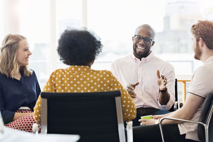 Smiling business people having a meeting in an office.