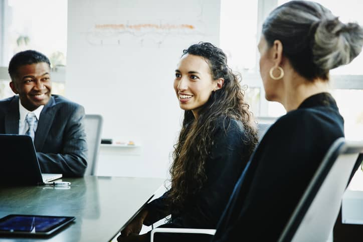 Diverse, inclusive group of office employees having a discussion.